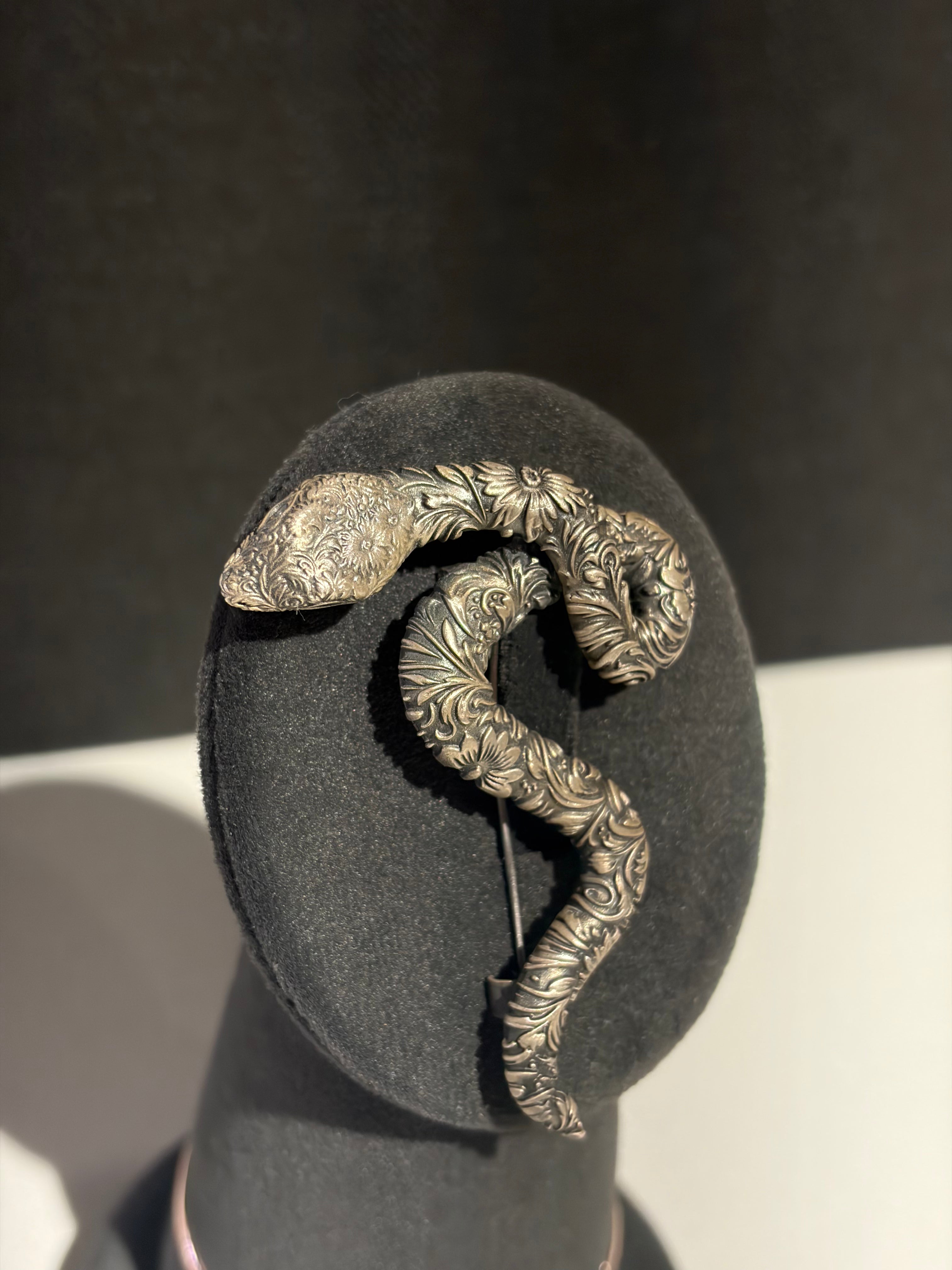 Sterling silver snake brooch with detailed floral engraving